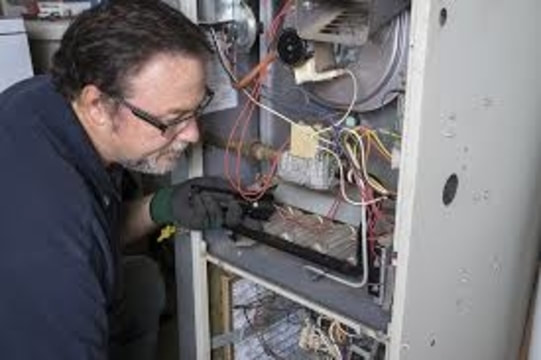 Man repairing furnace 